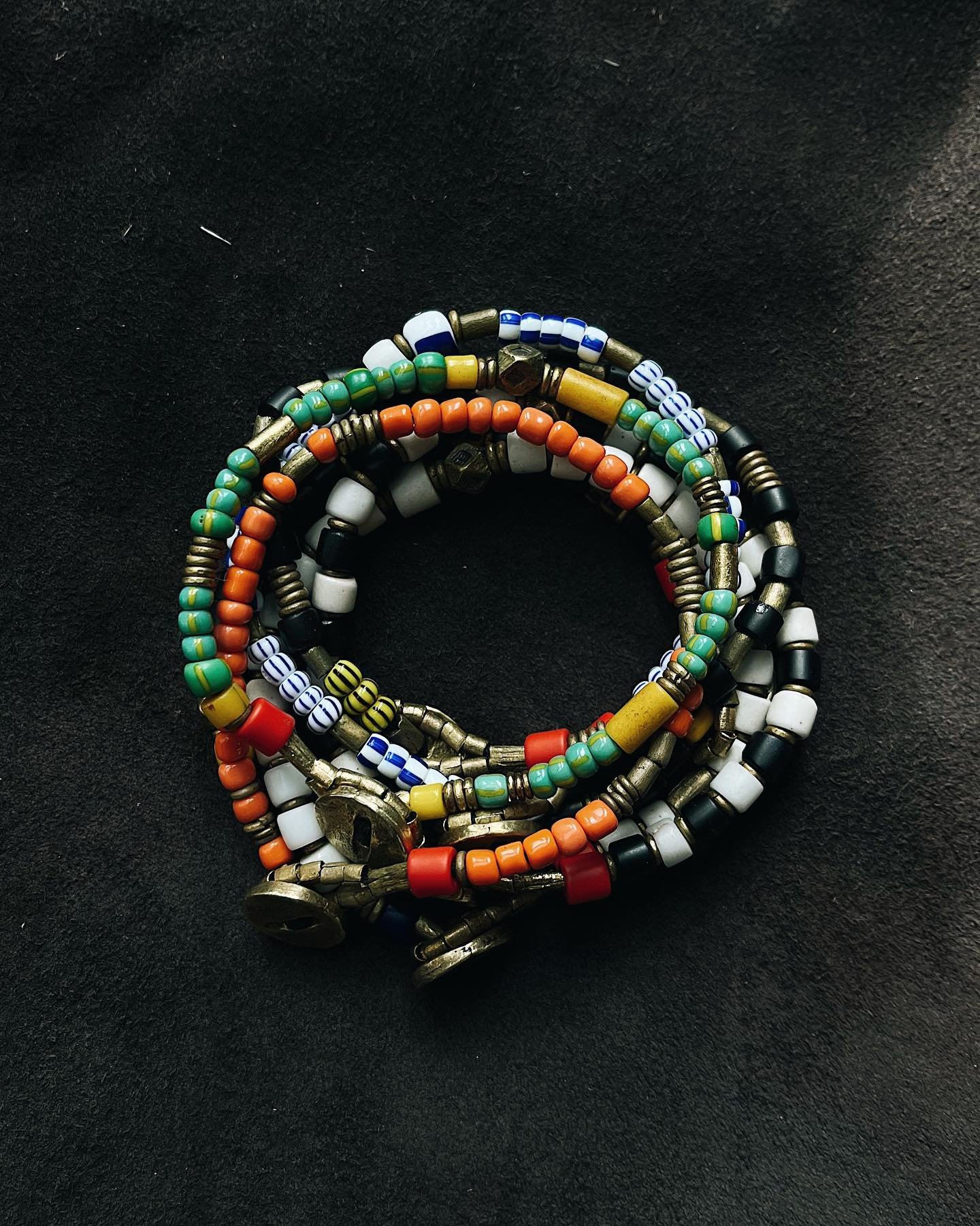 Vintage African trade glass and brass stacks &ndash; with a signature fish scale inspired raw brass clasp. ✨
