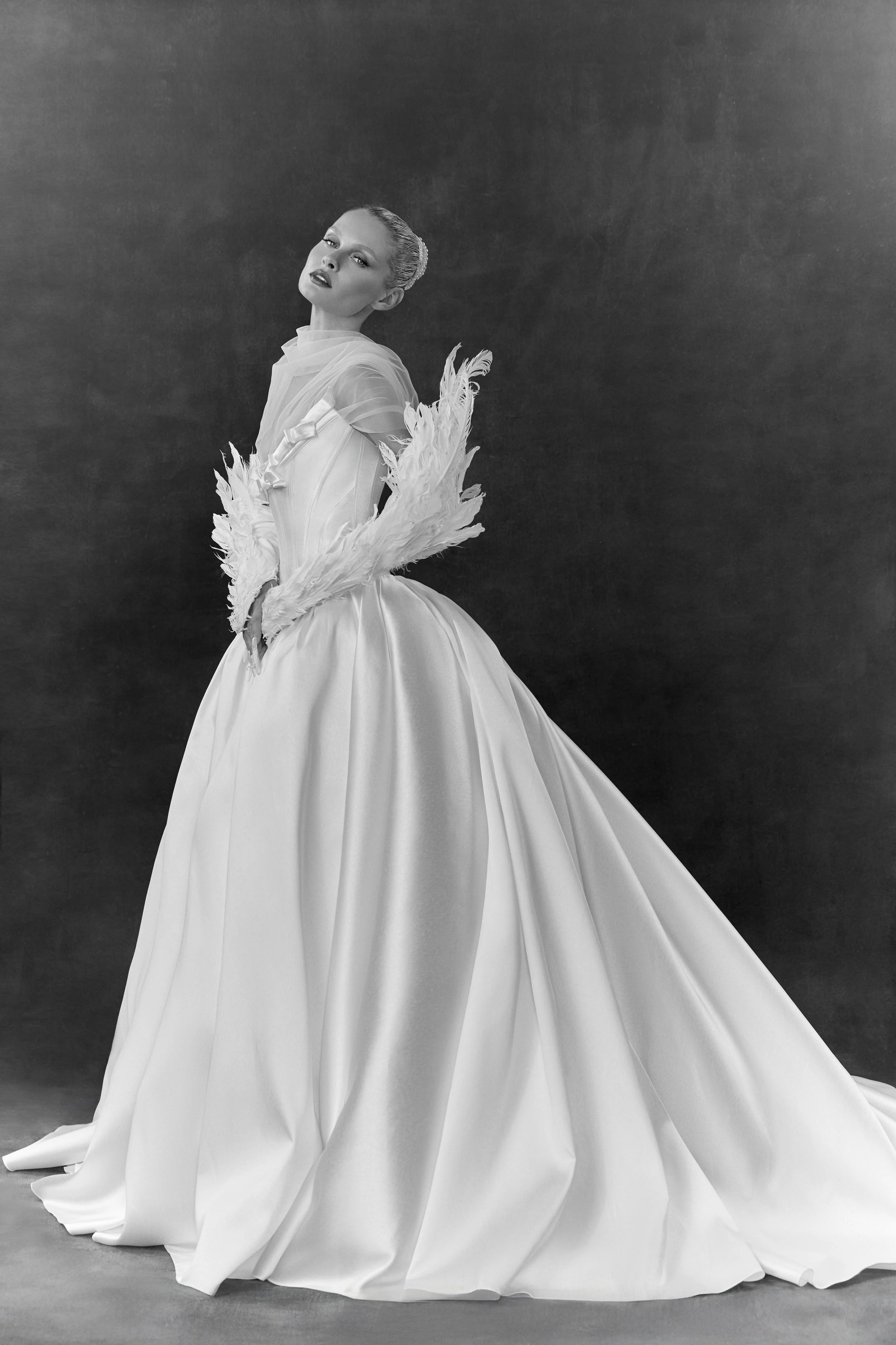 Ioanna wedding dress by Rara Avis — full front view of heavy satin ball gown with scoop neckline, ribbon trim detail, and dramatic long train