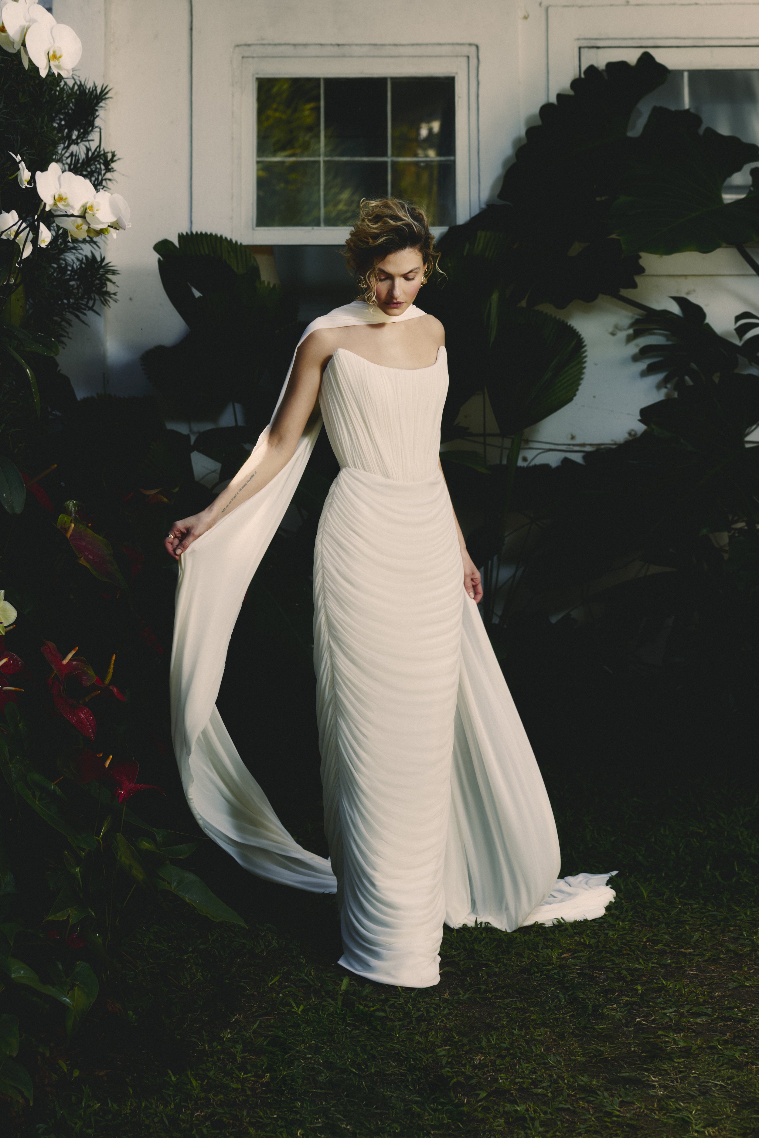 Light and elegant bridal dress by Rebeca Nepomuceno featuring textured mesh ruffles and sleek silhouette – Margarida