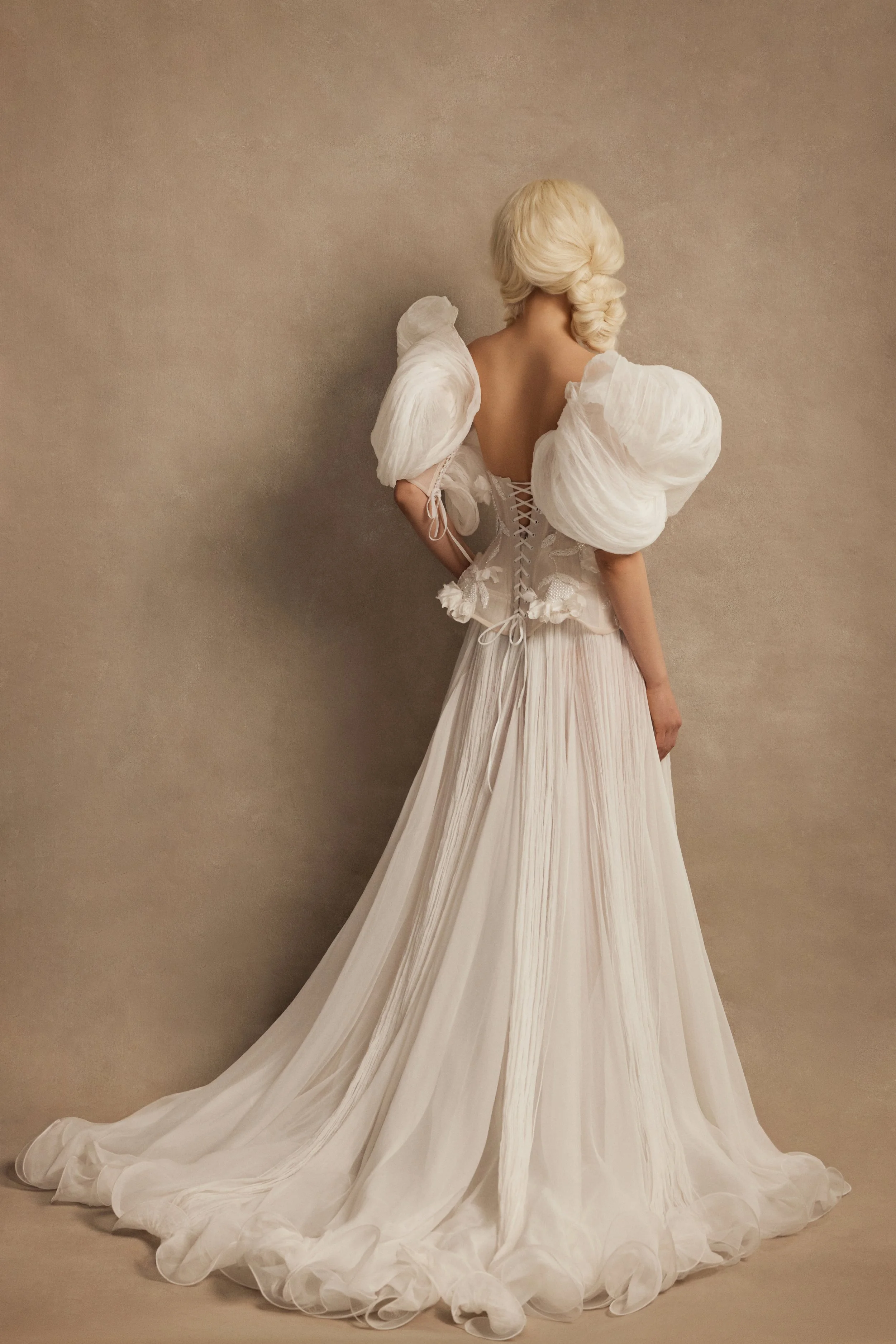Smitten wedding dress by Rara Avis — full front view of silk bridal set with embellished corset, silk flower appliqués, A-line skirt, and voluminous structured sleeves