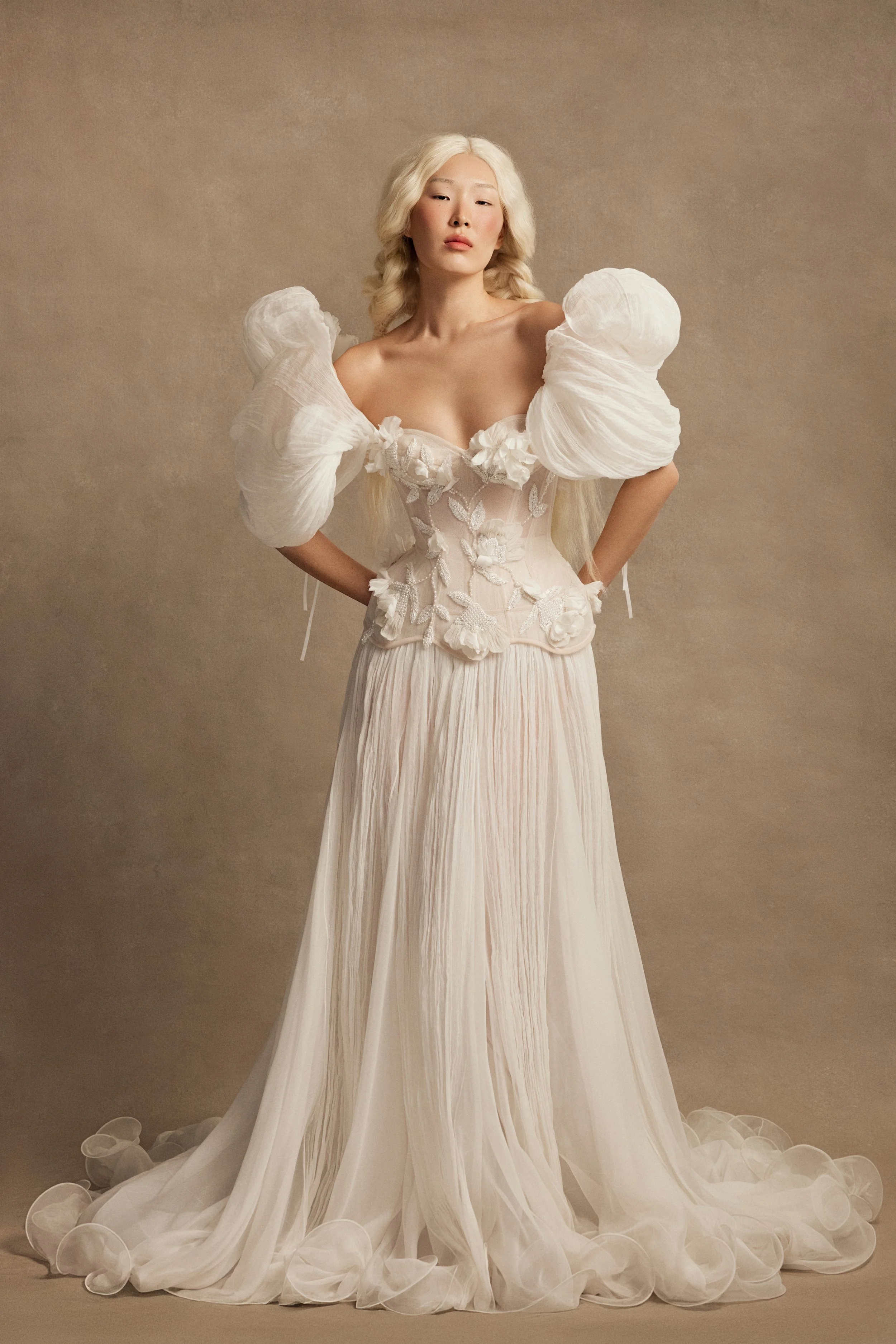Smitten wedding dress by Rara Avis — full front view of silk bridal set with embellished corset, silk flower appliqués, A-line skirt, and voluminous structured sleeves