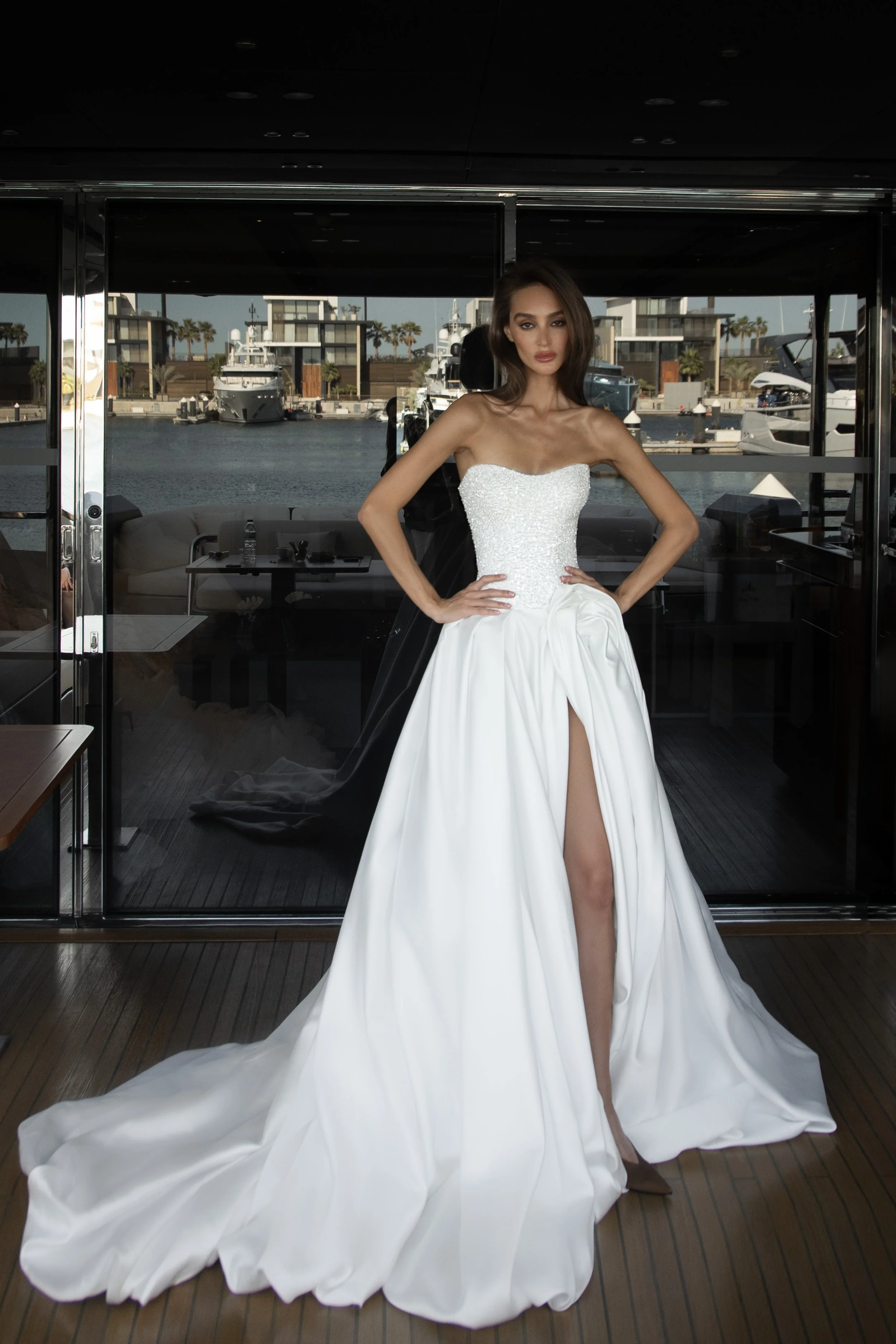Harris bridal gown by Natalia Romanova featuring statement draping, a fitted strapless bodice, and a modern A-line silhouette