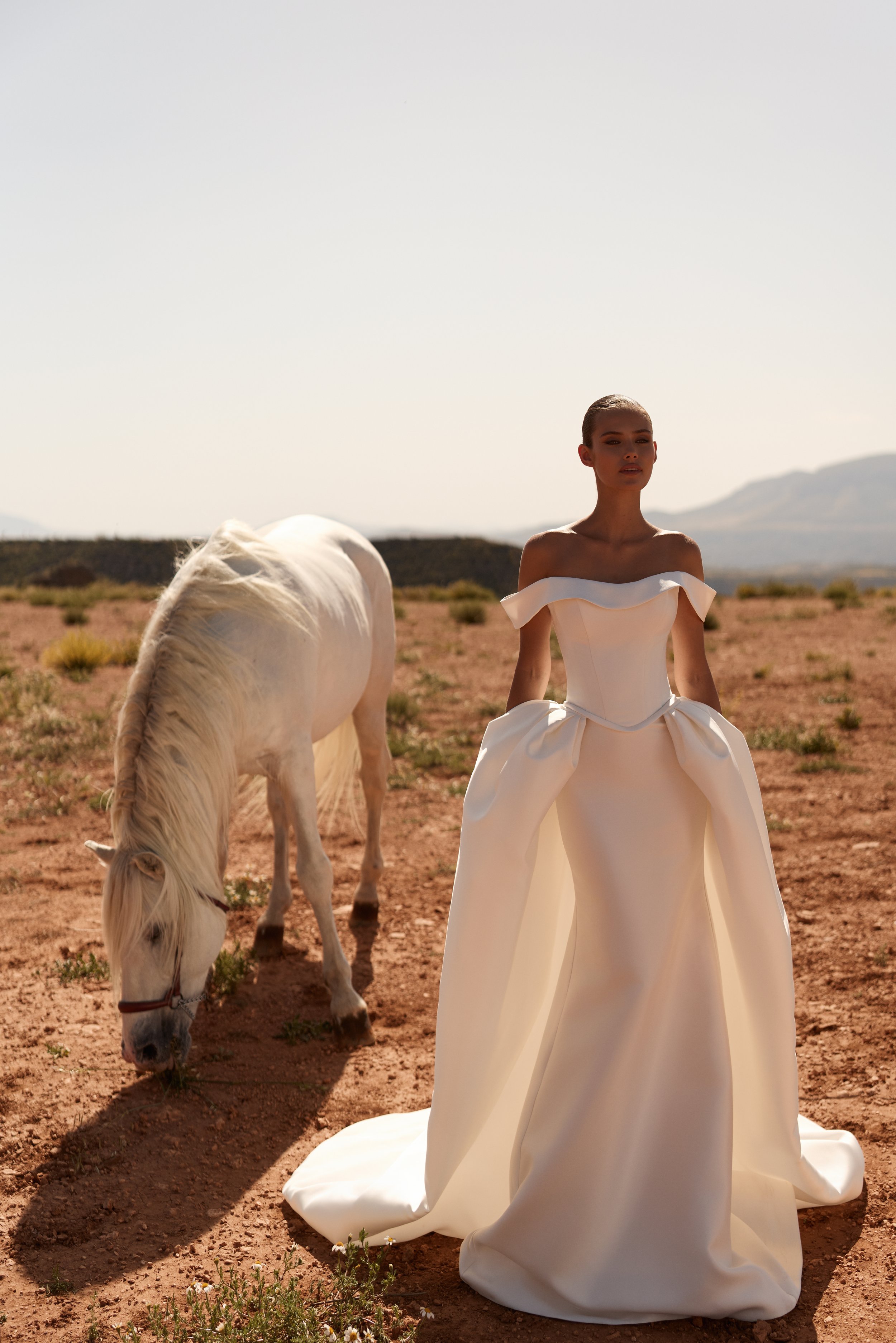 off-the-shoulder wedding dress, satin wedding dress, corset wedding dress, detachable overskirt wedding dress, convertible wedding dress, minimalist wedding dress NYC