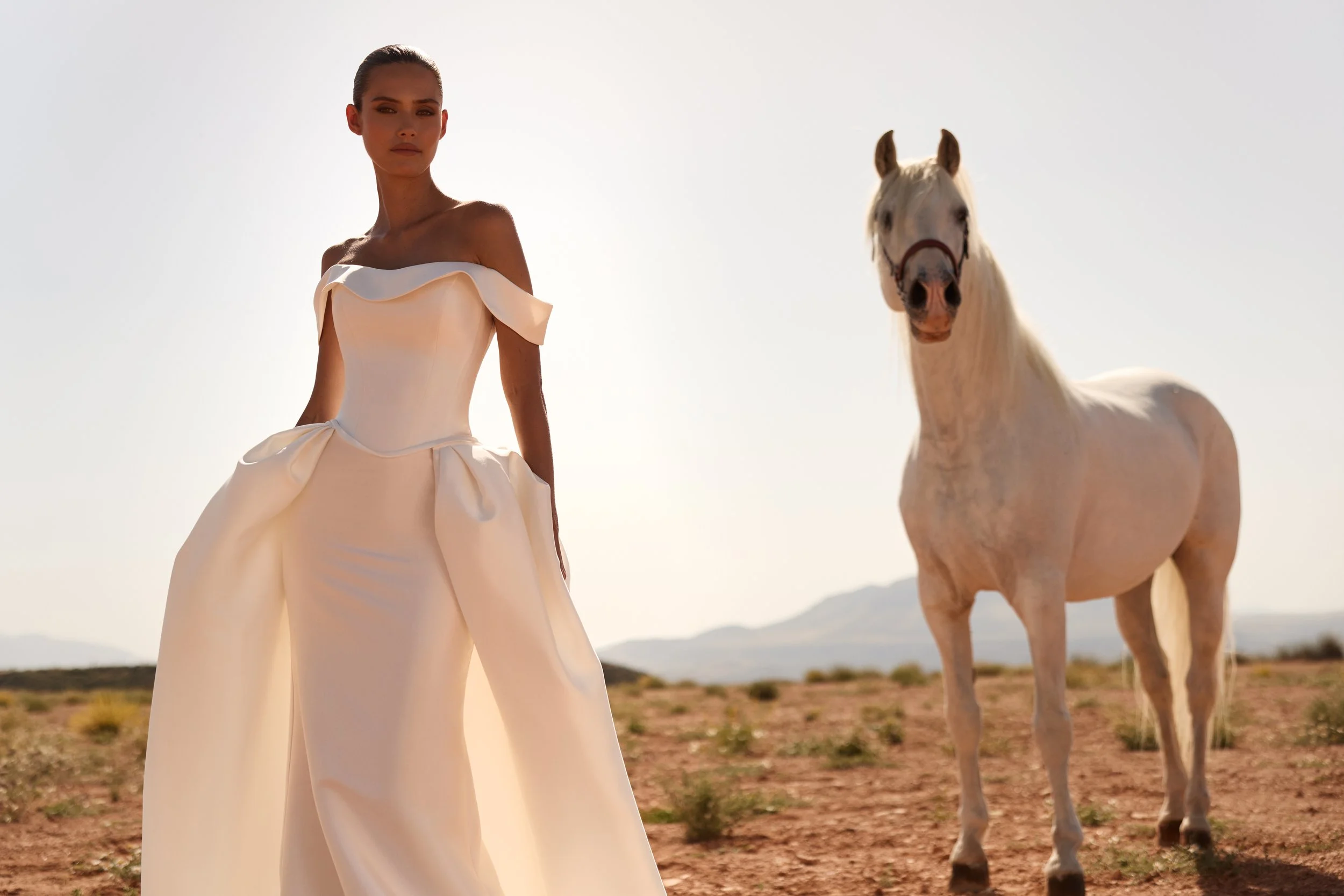 off-the-shoulder wedding dress, satin wedding dress, corset wedding dress, detachable overskirt wedding dress, convertible wedding dress, minimalist wedding dress NYC