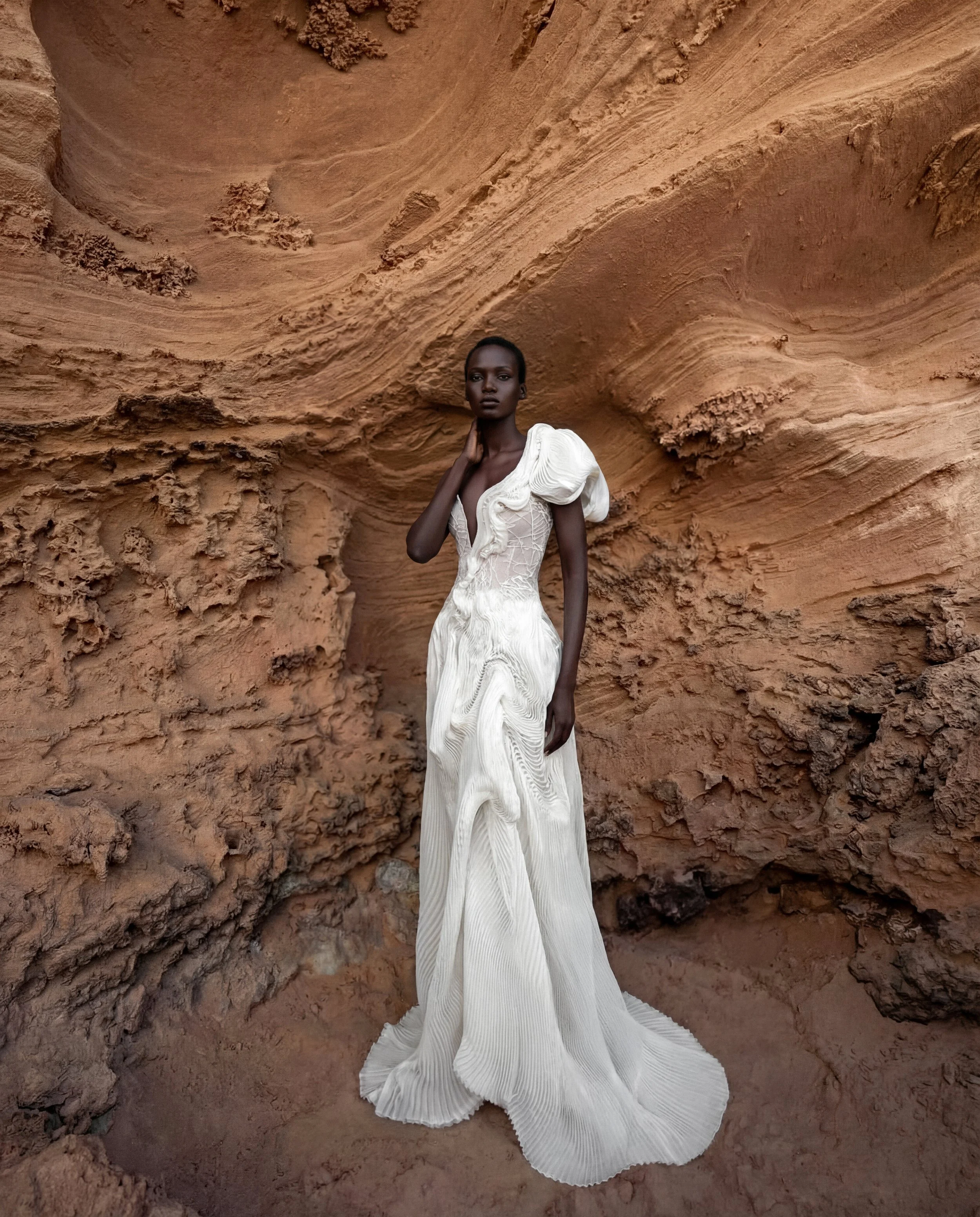 Asymmetrical wedding dress by Lana Marinenko made from pleated organza with a modern sculptural silhouette