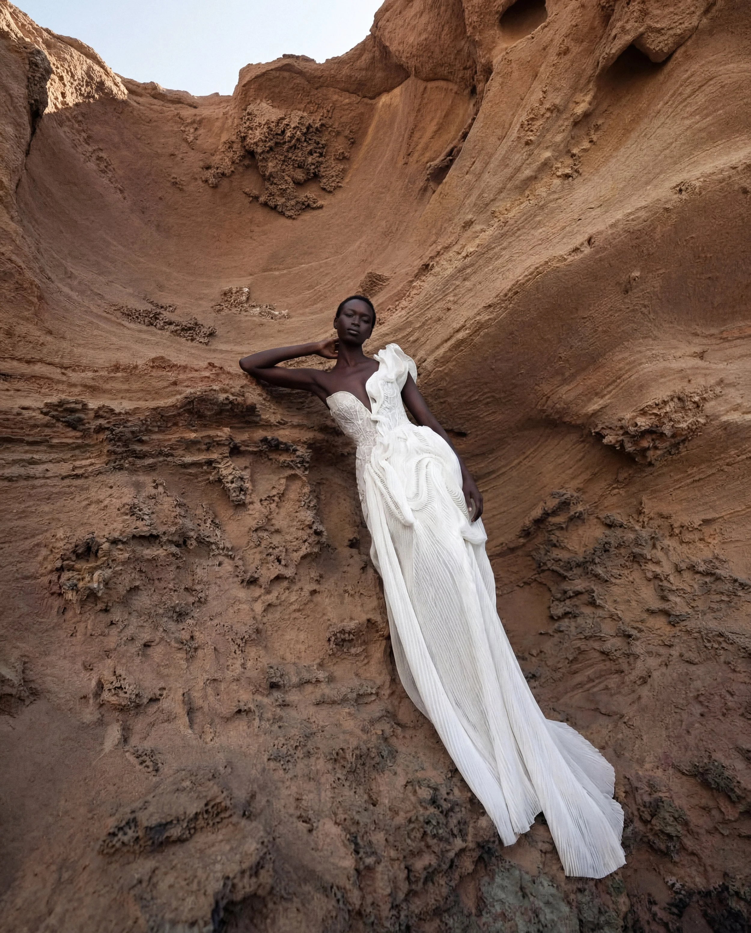 Asymmetrical wedding dress by Lana Marinenko made from pleated organza with a modern sculptural silhouette
