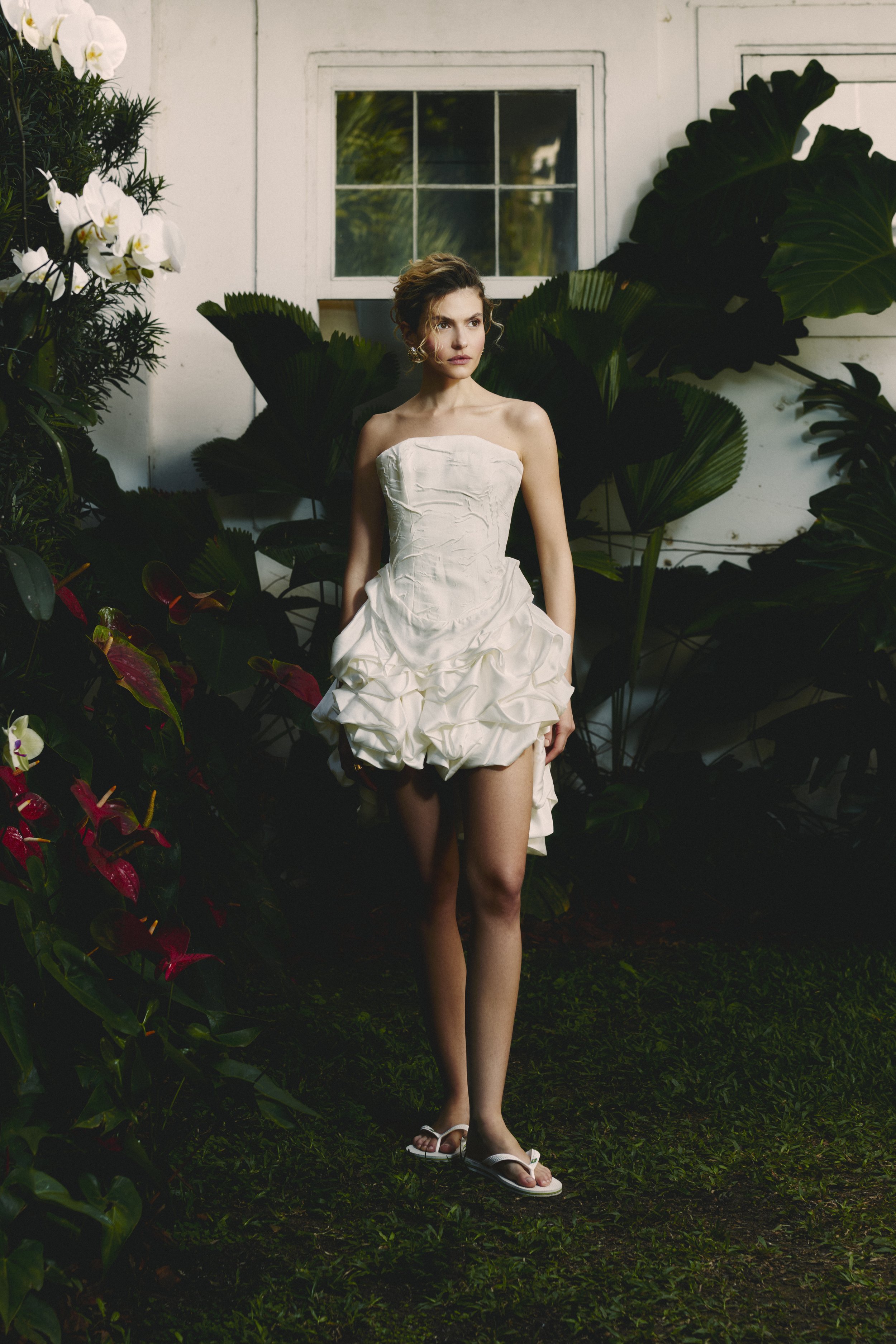 Modern short wedding dress by Rebeca Nepomuceno with playful ruffles and underskirt creating long-dress effect – Silvia