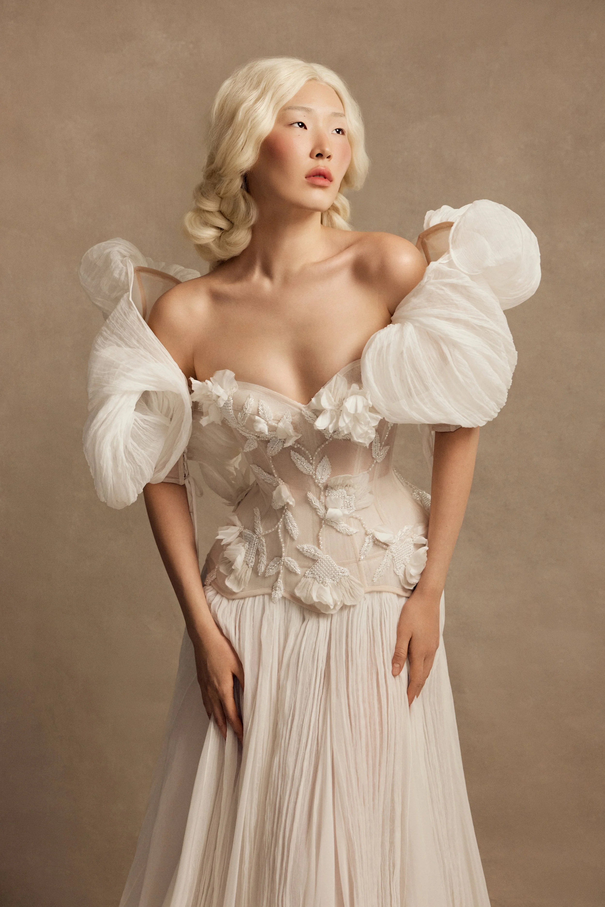 Smitten wedding dress by Rara Avis — full front view of silk bridal set with embellished corset, silk flower appliqués, A-line skirt, and voluminous structured sleeves