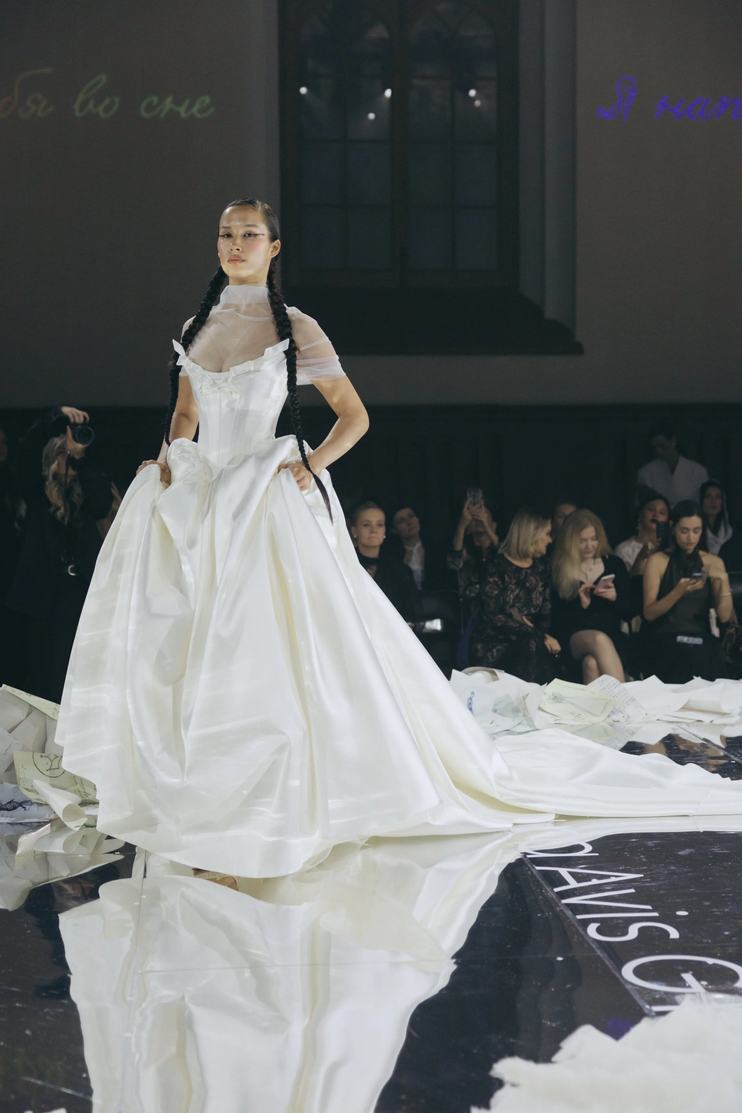 Ioanna wedding dress by Rara Avis — full front view of heavy satin ball gown with scoop neckline, ribbon trim detail, and dramatic long train