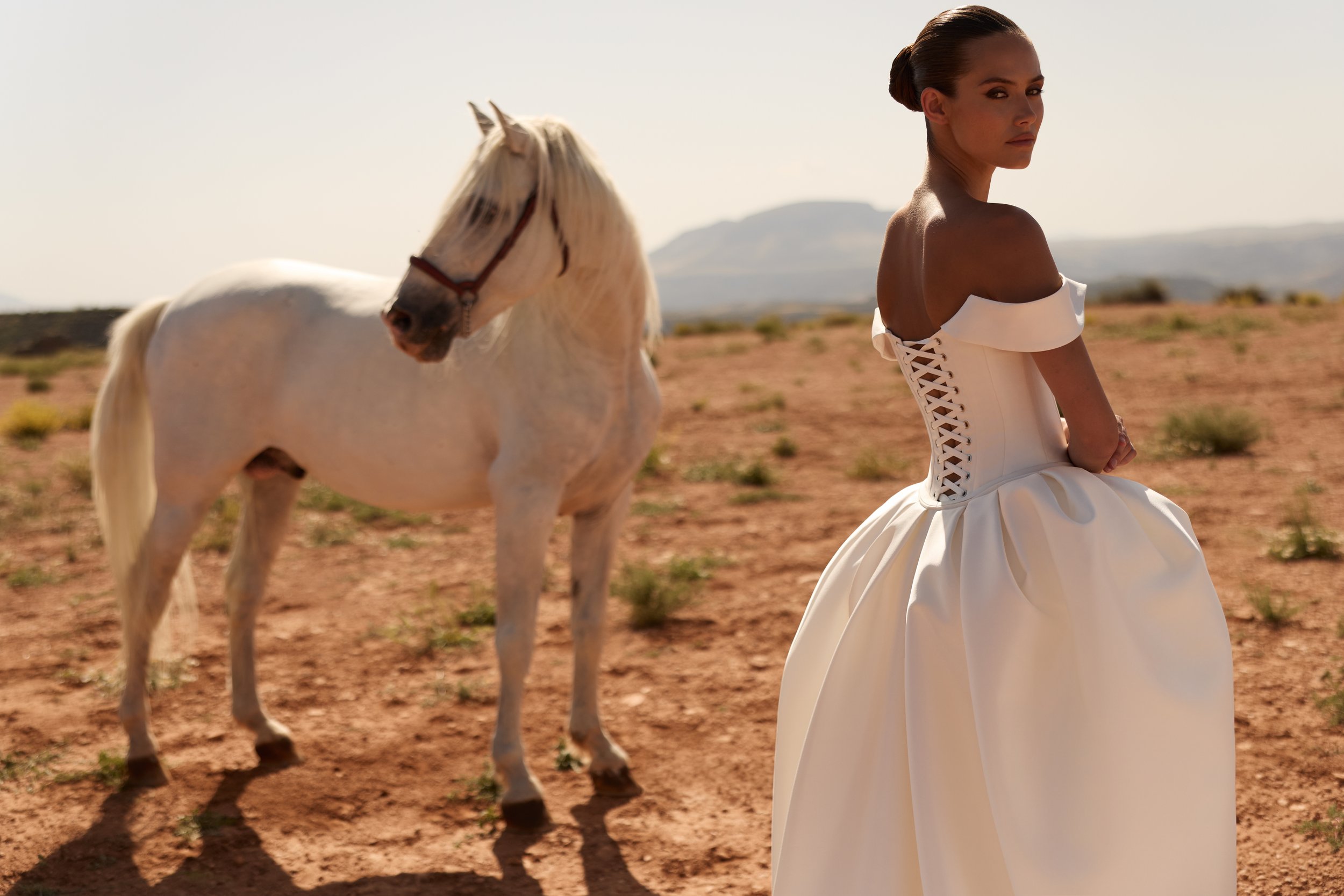 off-the-shoulder wedding dress, satin wedding dress, corset wedding dress, detachable overskirt wedding dress, convertible wedding dress, minimalist wedding dress NYC