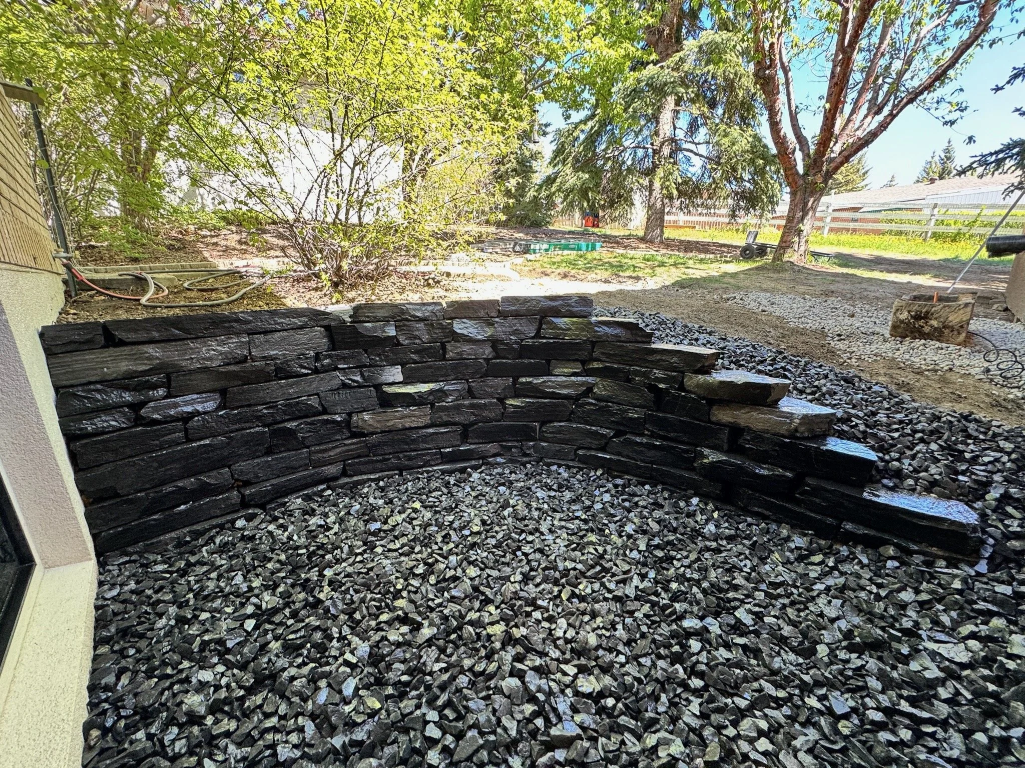 Rundle ledgestone window well.