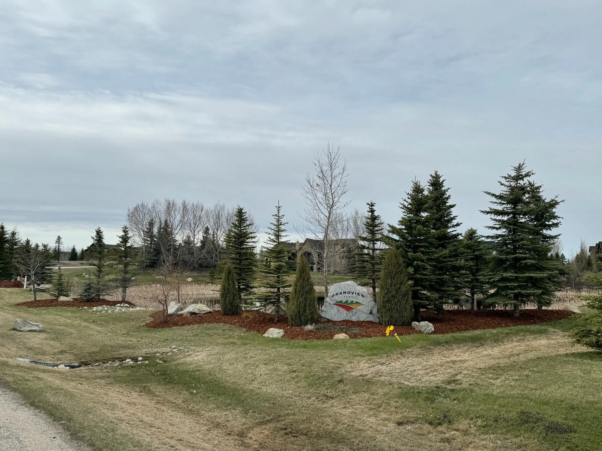 Garden bed mulch top up and spring clean up in community spaces.