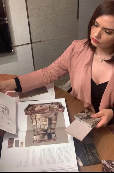 Interior designer reviewing materials and finishes during a neurodesign closet design process focused on sensory balance, clarity, and functionality