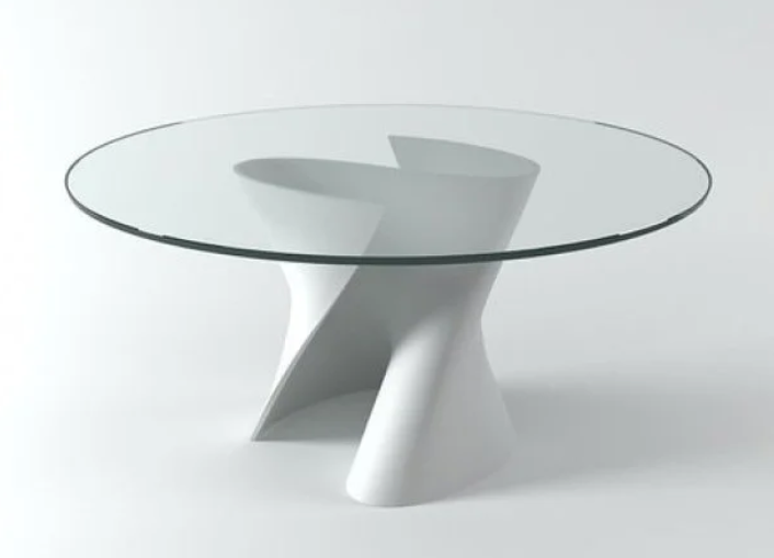 Modern S table by Xavier Lust, featuring a distinctive S-shaped twisted base with a round glass top.