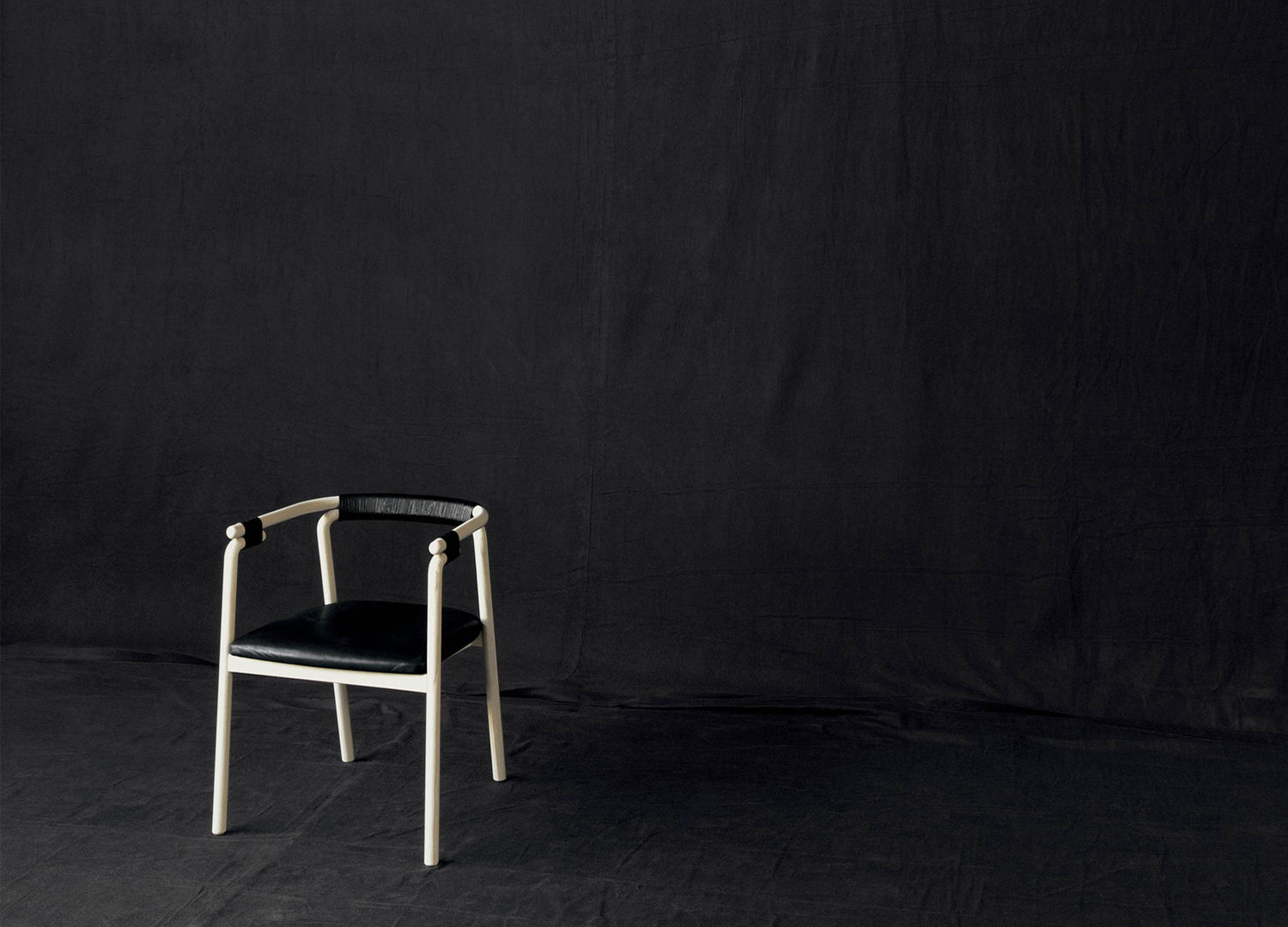RIVULET designer dining chair with sculptural woven seat design