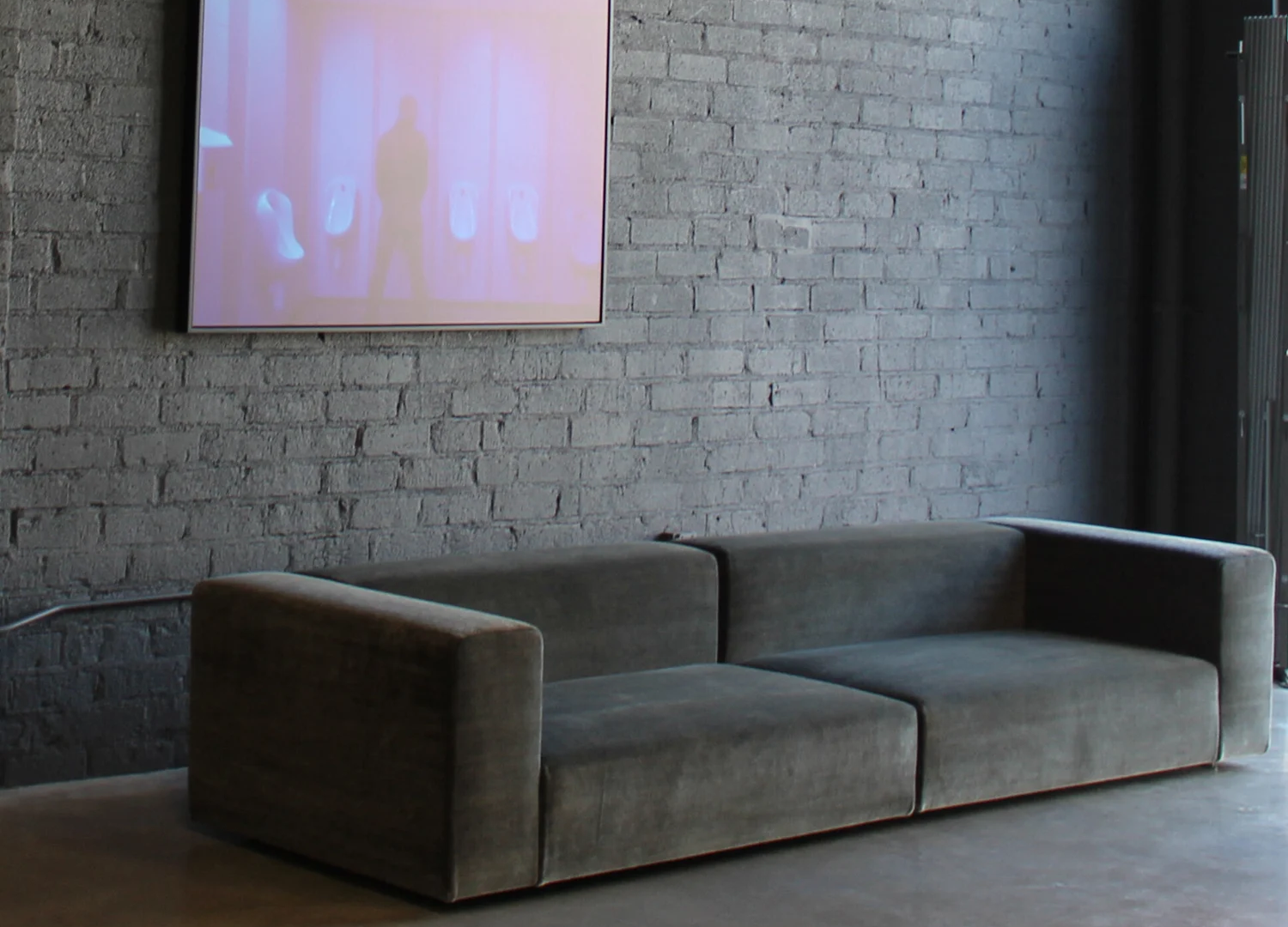 Elegant Wall sofa designed around plush cushions for everyday family spaces.