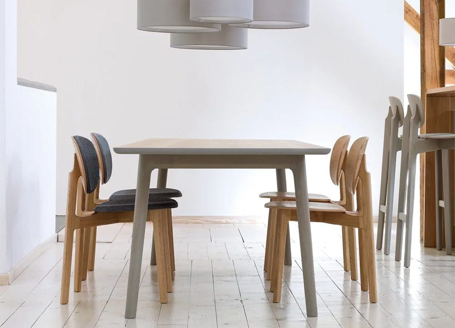 ZENSO dining chair with walnut frame and upholstered seating