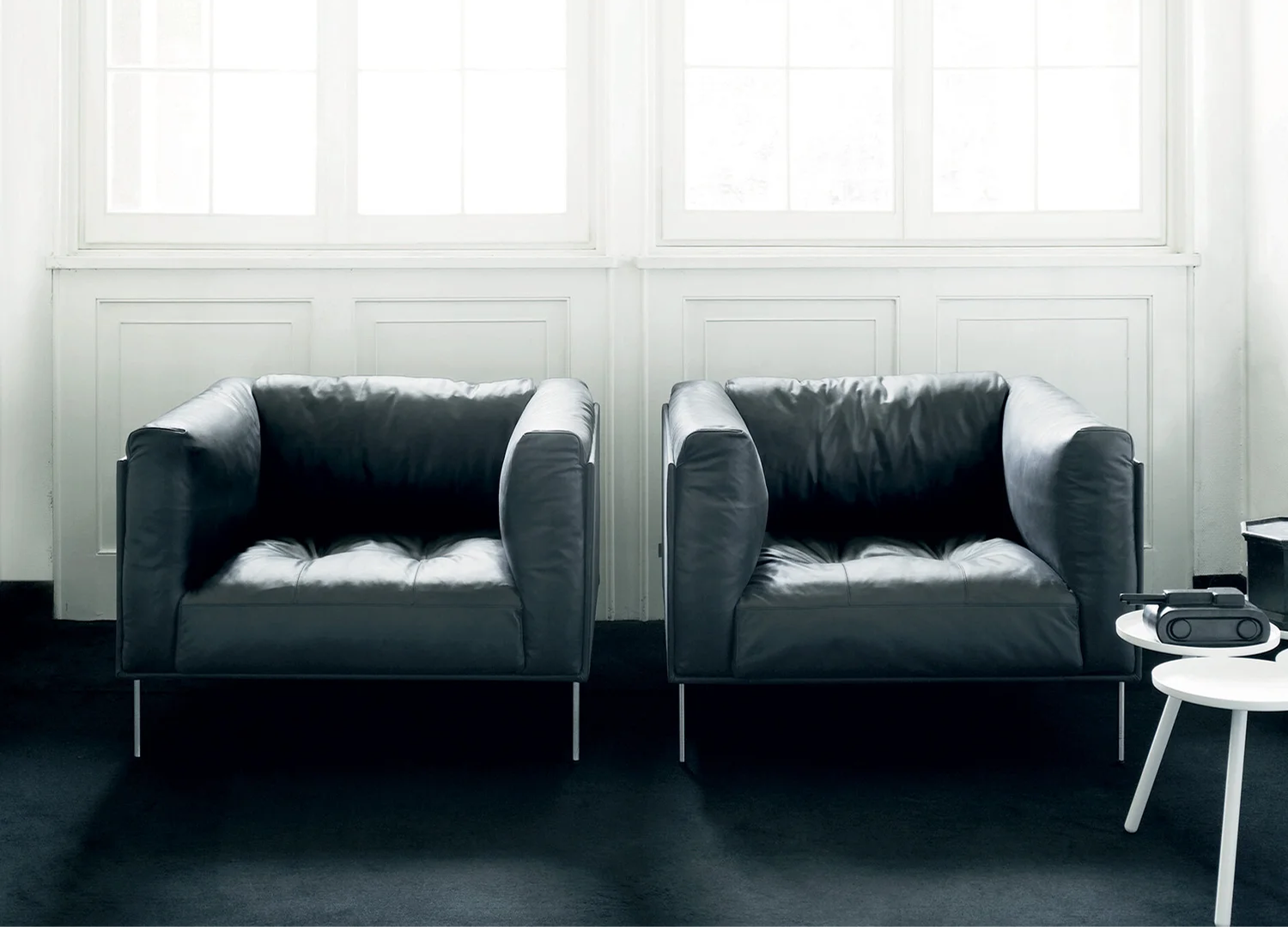 Rod lounge chair with streamlined silhouette and modern aesthetic