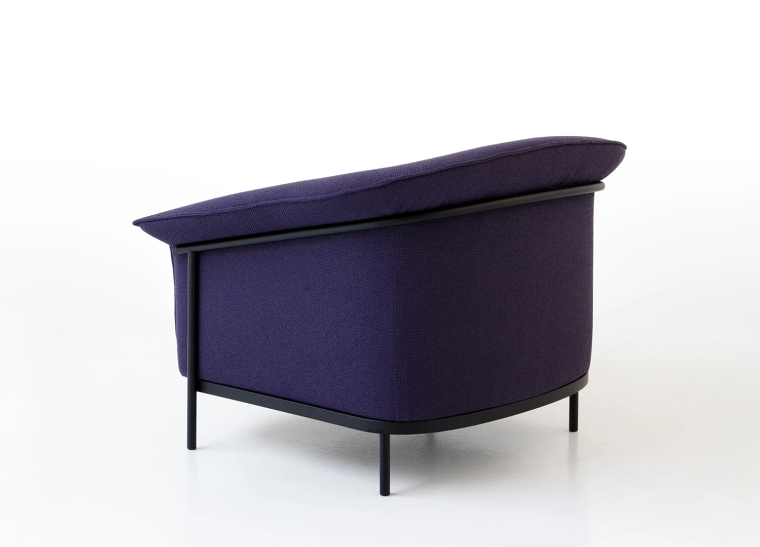 Kite Chair armchair with open silhouette and elegant upholstery