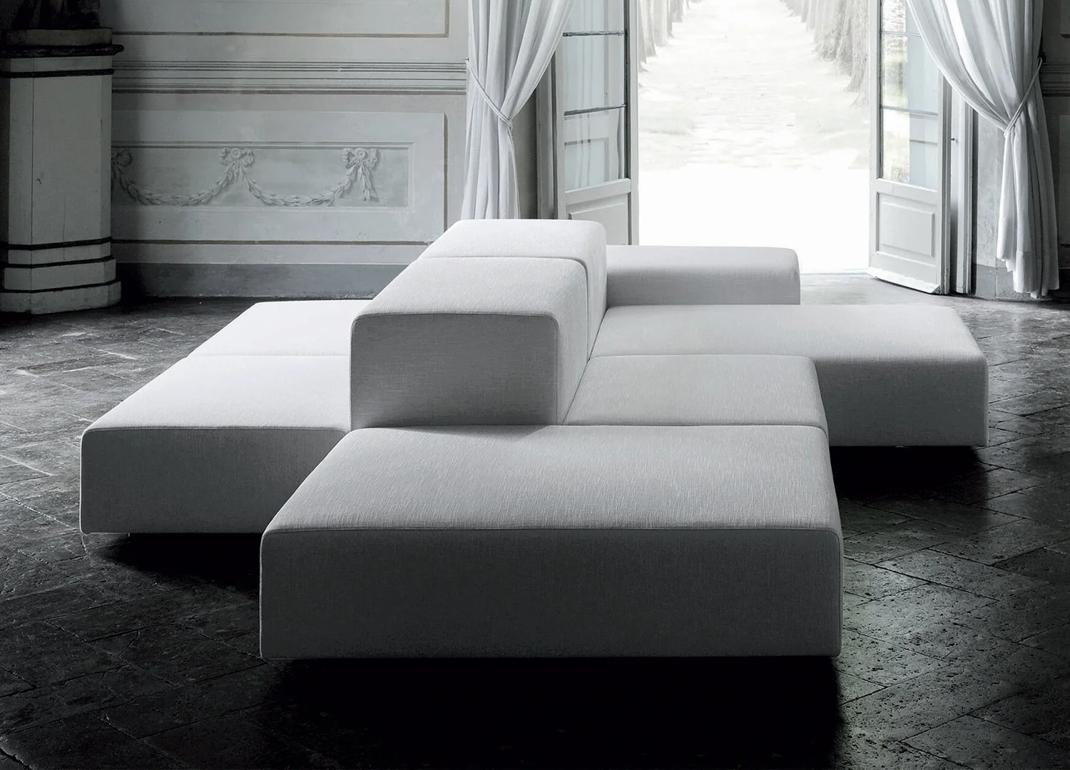 Elegant Extra Wall sofa designed around architectural lines for elegant settings.