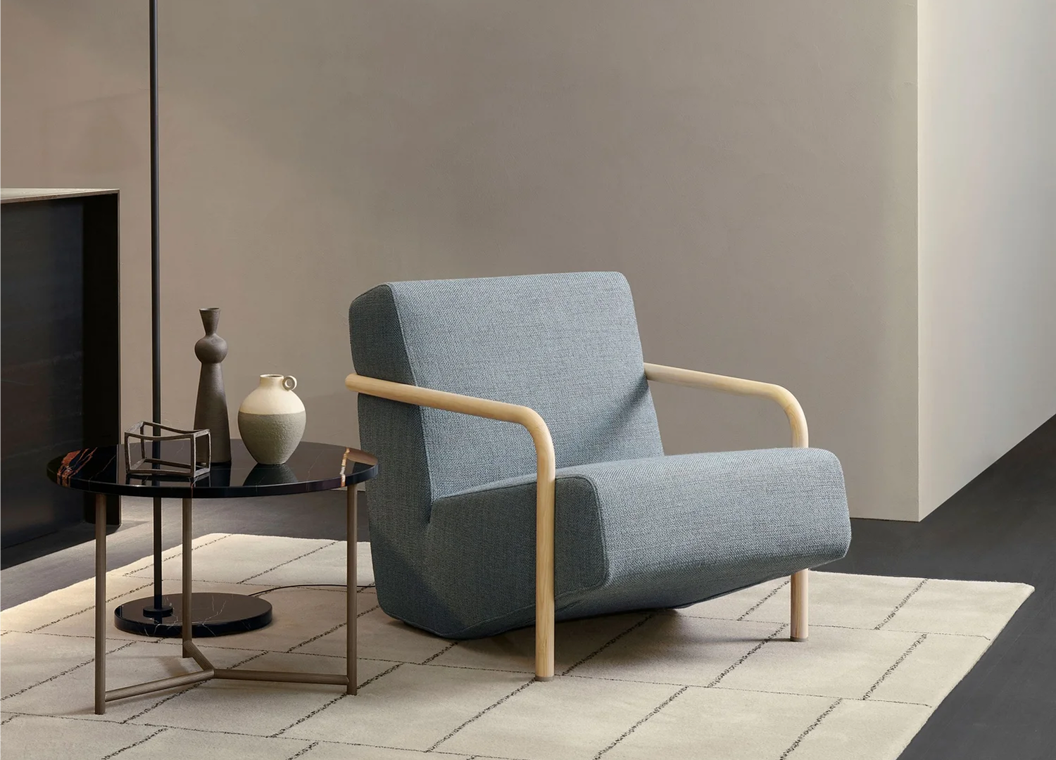 Lullaby Chair with leather or fabric upholstery and curved frame