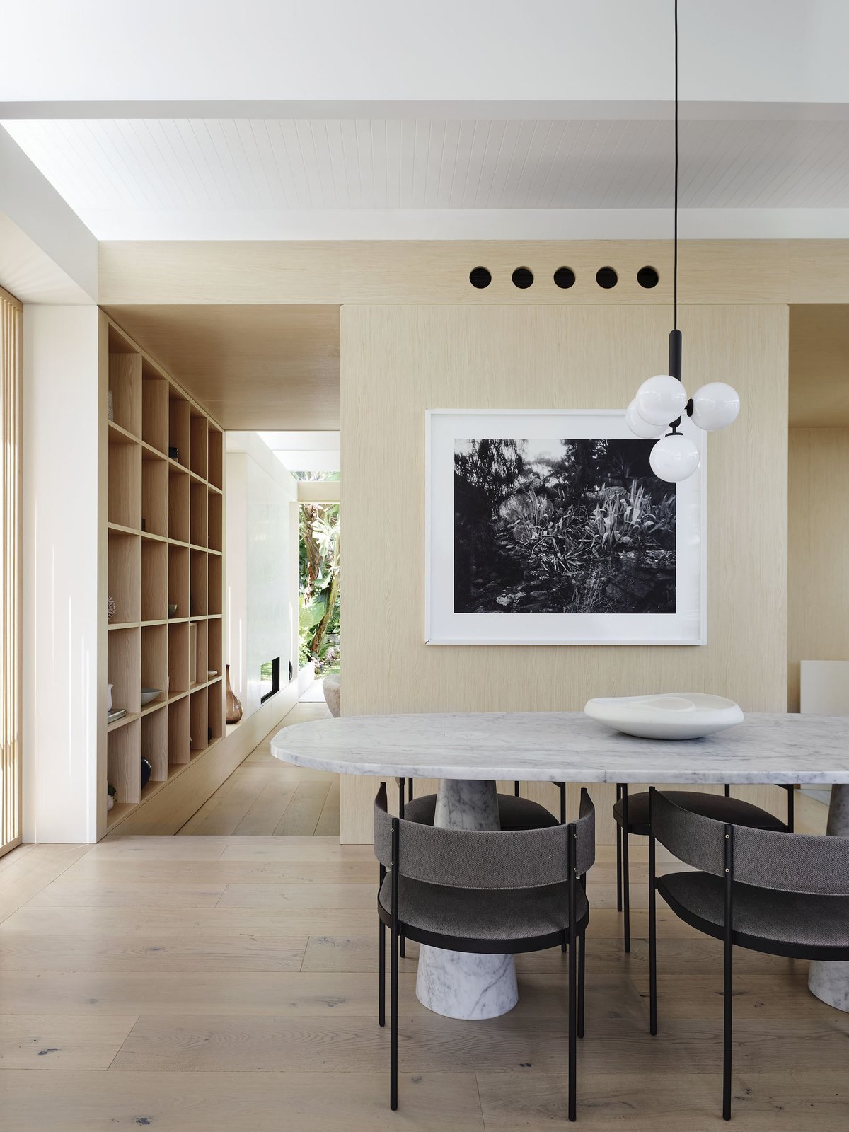 a-nuura-miira-4-pendant-light-hangs-above-the-custom-one-ton-marble-dining-table-surrounded-by-era-dining-chairs-by-living-divani-from-space-saving-furniture-australia-the-framed-photograph-is-by-paul-ogier (1).jpg