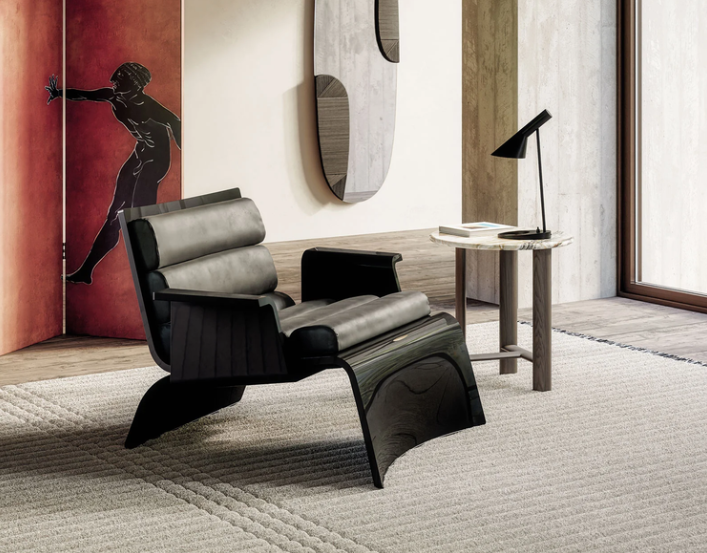 Linda lounge chair with a generously upholstered seat and a sculptural silhouette in a refined contemporary living room.