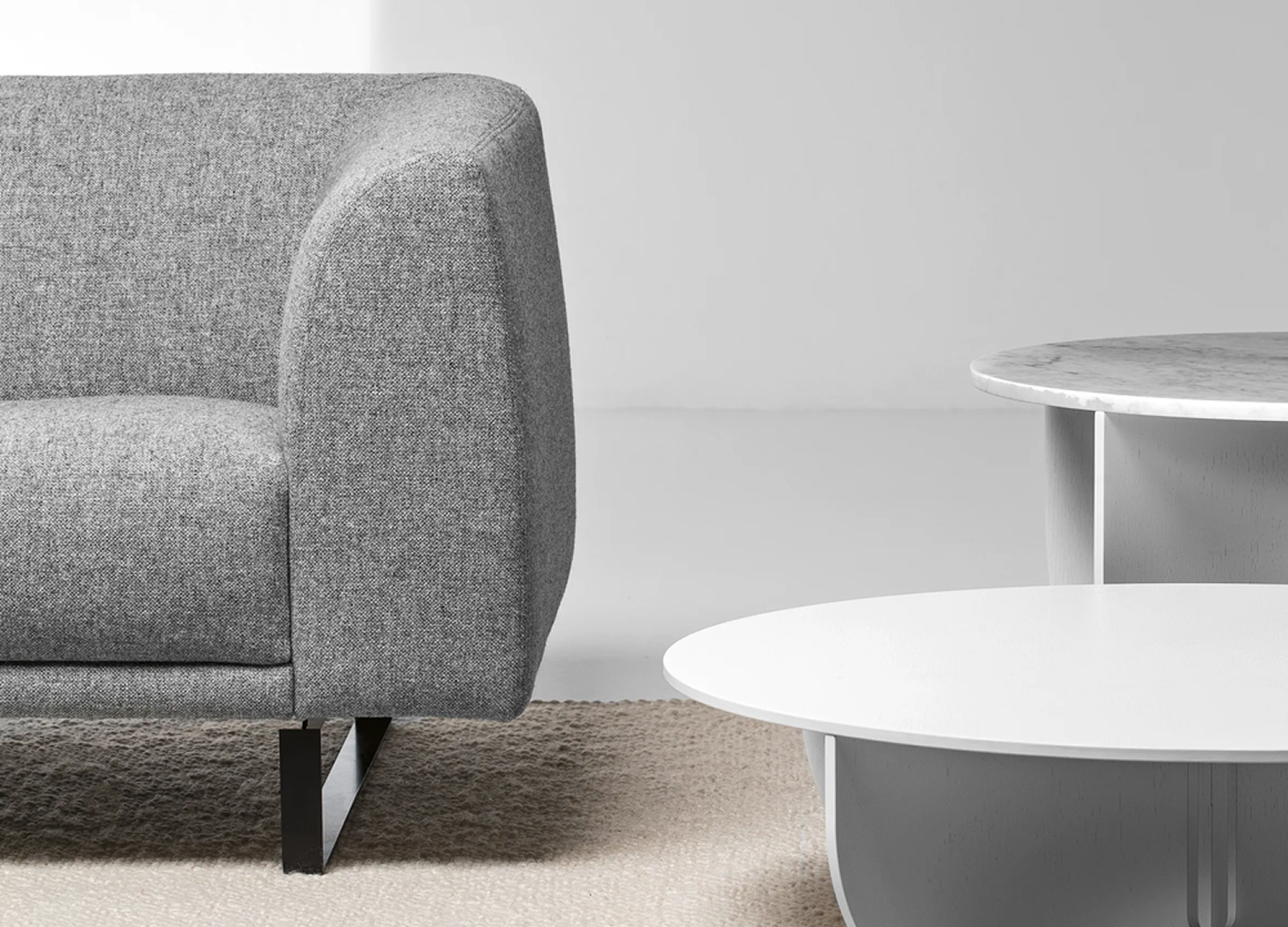 Tailor Chair with sculpted seating form and elegant sled base