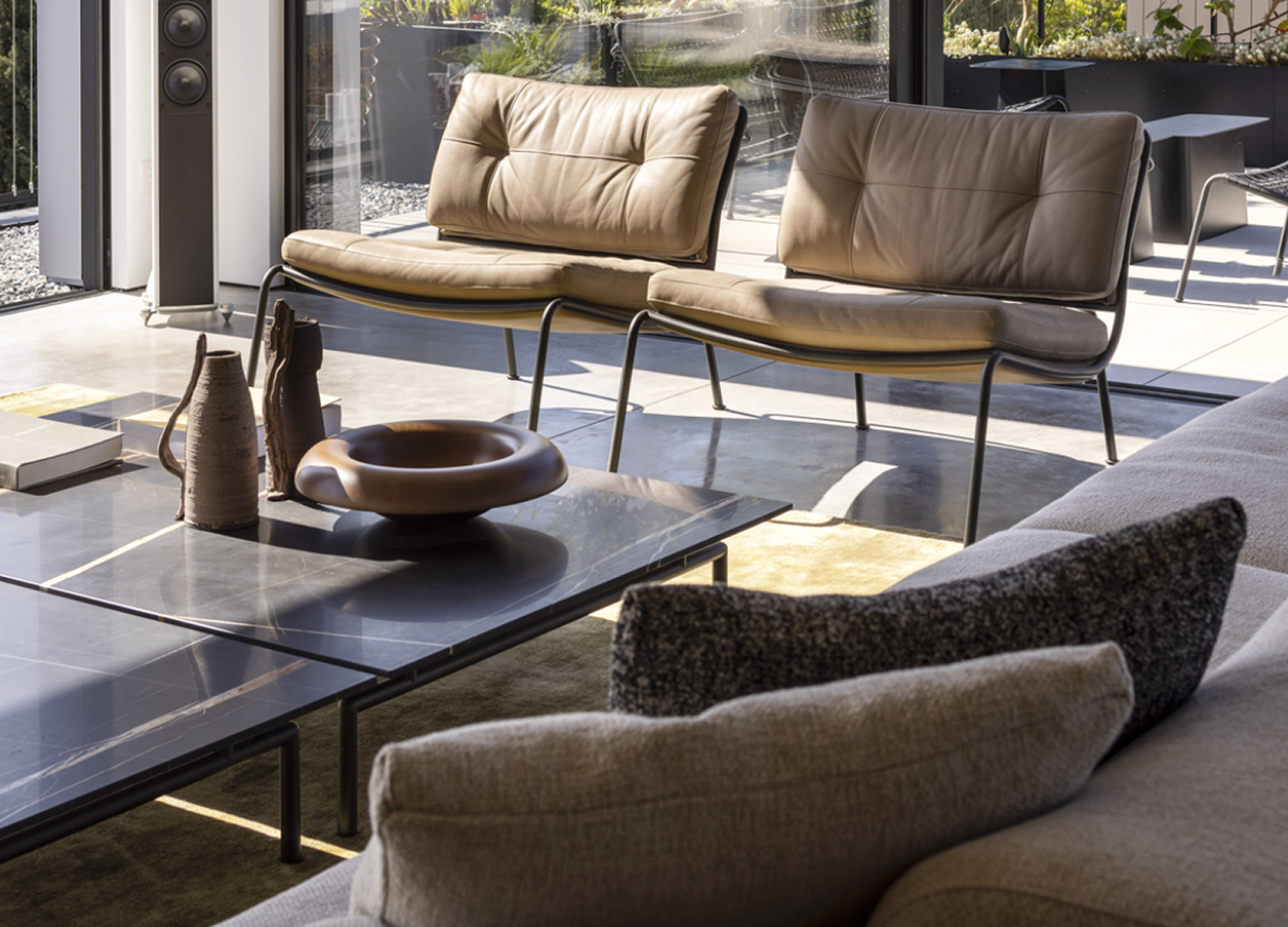 Frog Chair with enveloping curves and refined Italian design