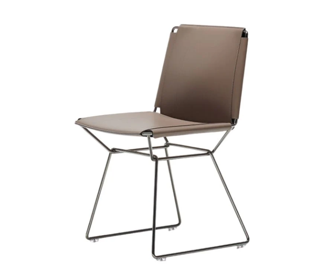 Neil dining chair by Jean Marie Massaud with a slim metal frame and upholstered leather seat.