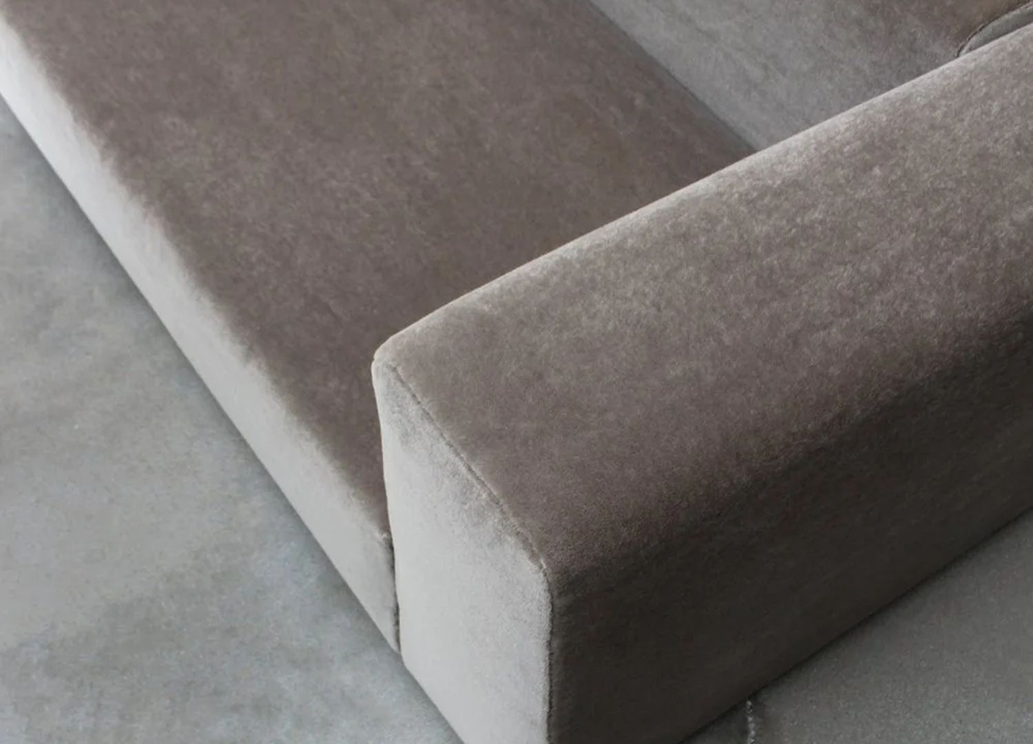Wall sofa highlighting modular flexibility for open-plan spaces.
