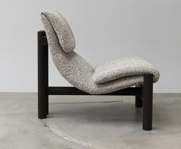 Ada lounge chair by Ferruccio Laviani with solid ash structure and upholstered leather seat.