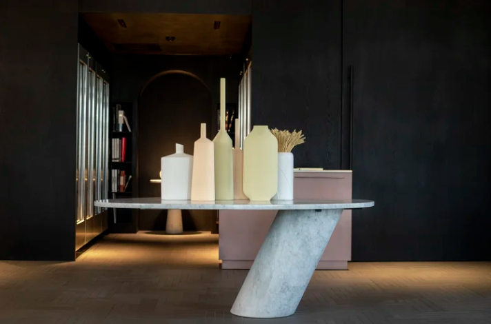 Eccentrico all-marble dining table by Angelo Mangiarotti with a sculptural cylindrical base.