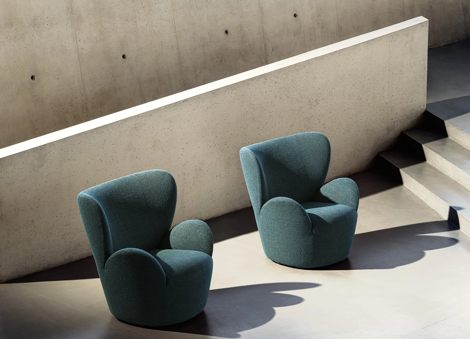 LIBELLE designer armchair with curved upholstered form