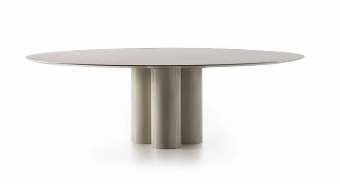 Modern Elly dining table featuring an oval glossy beige tabletop resting on a base of central cylindrical column legs.