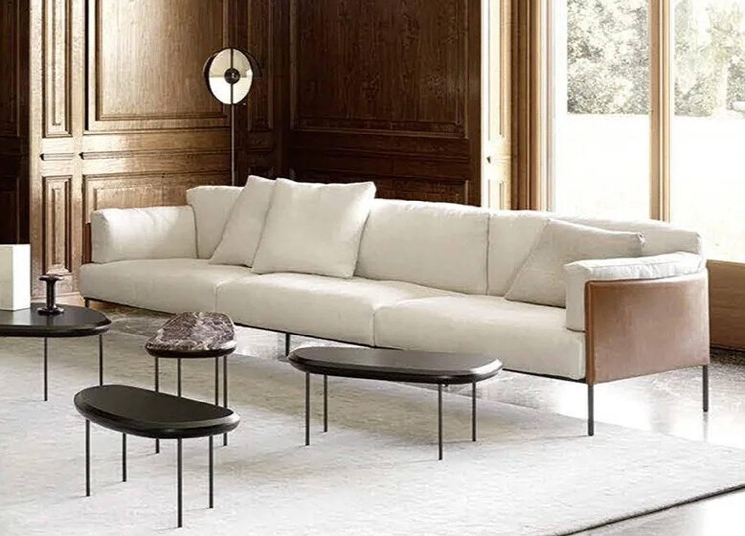 Greene Italian designer sofa with smooth profile and saddle leather shell