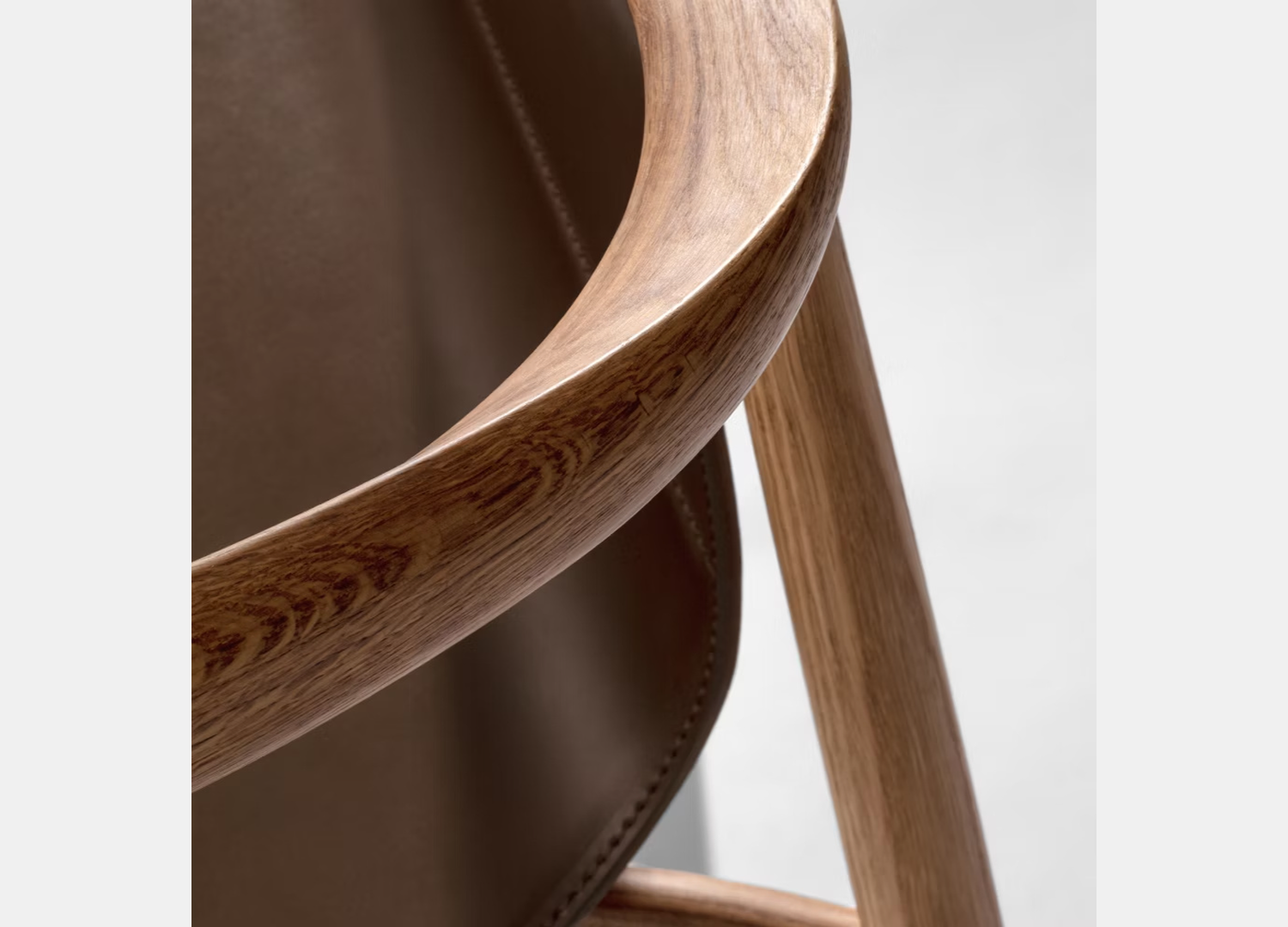 Pelle Dining Chair with suspended seat and minimalist support