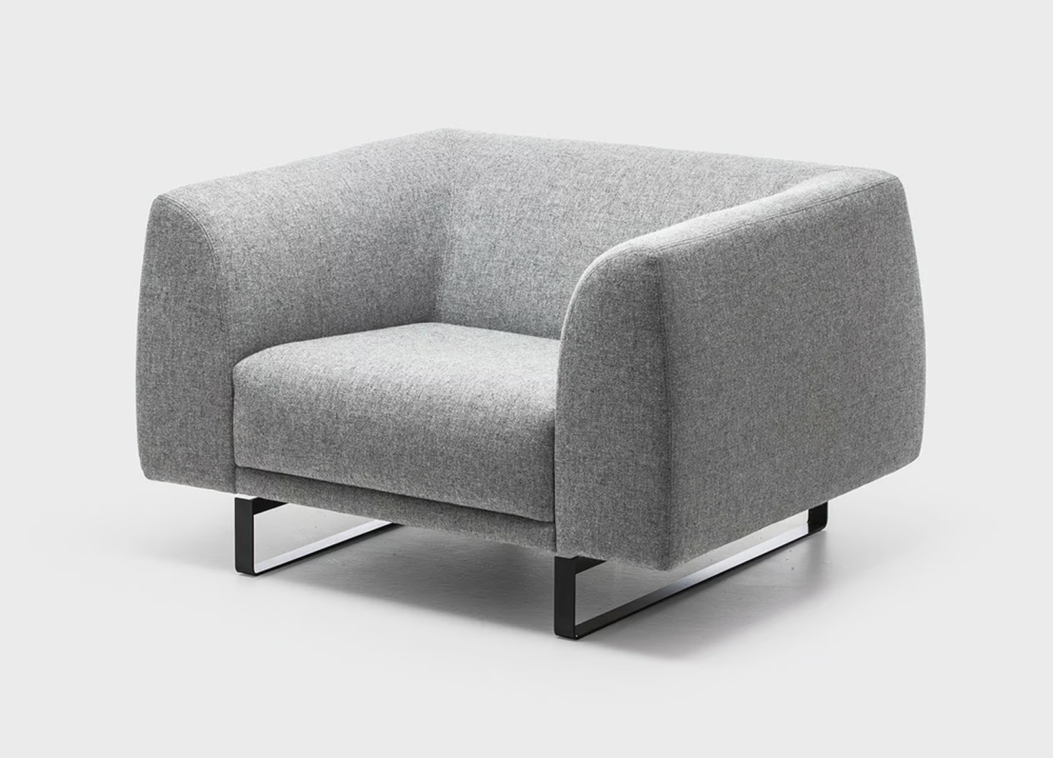 Tailor Chair with generous proportions and refined sled base