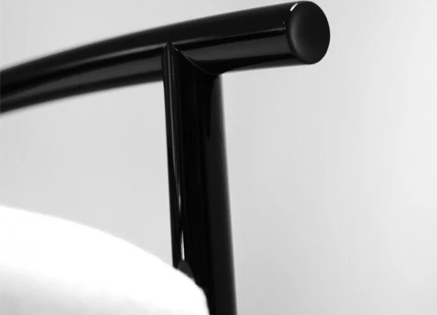 KASUMI contemporary armchair with sculpted upholstered silhouette