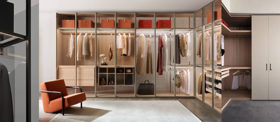 Porro walk-in closet system featuring glass-fronted wardrobes with bronze metal frames, displaying organized clothing in neutral tones, orange storage boxes, and light wood shelving, complemented by an orange armchair in a modern dressing room.