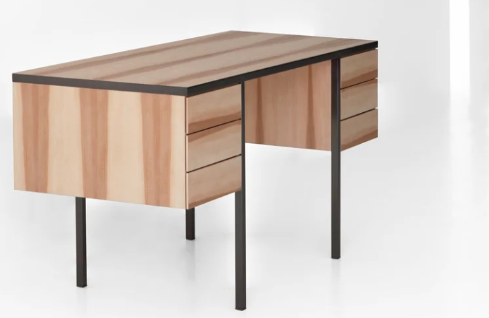 Collector desk featuring a wood veneer body with vertical graining, dual side drawer pedestals, and a dark metal frame base.