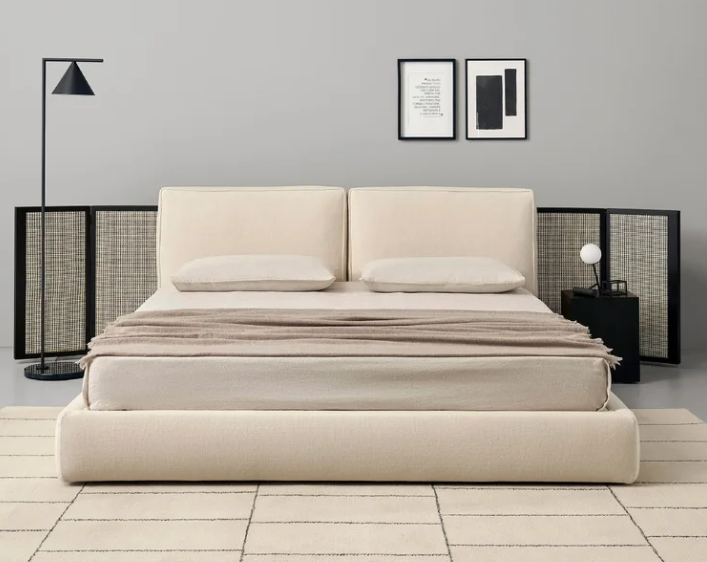 Byron bed by Piero Lissoni with a generously upholstered headboard and refined contemporary proportions in a luxury bedroom.
