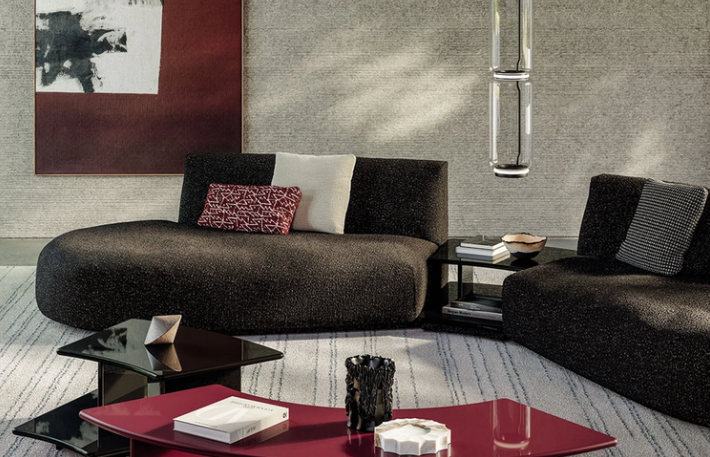 Modern Dao sectional sofa designed by Gordon Guillaumier with dark, textured upholstery and rounded low-profile seats in a sleek living room setting.