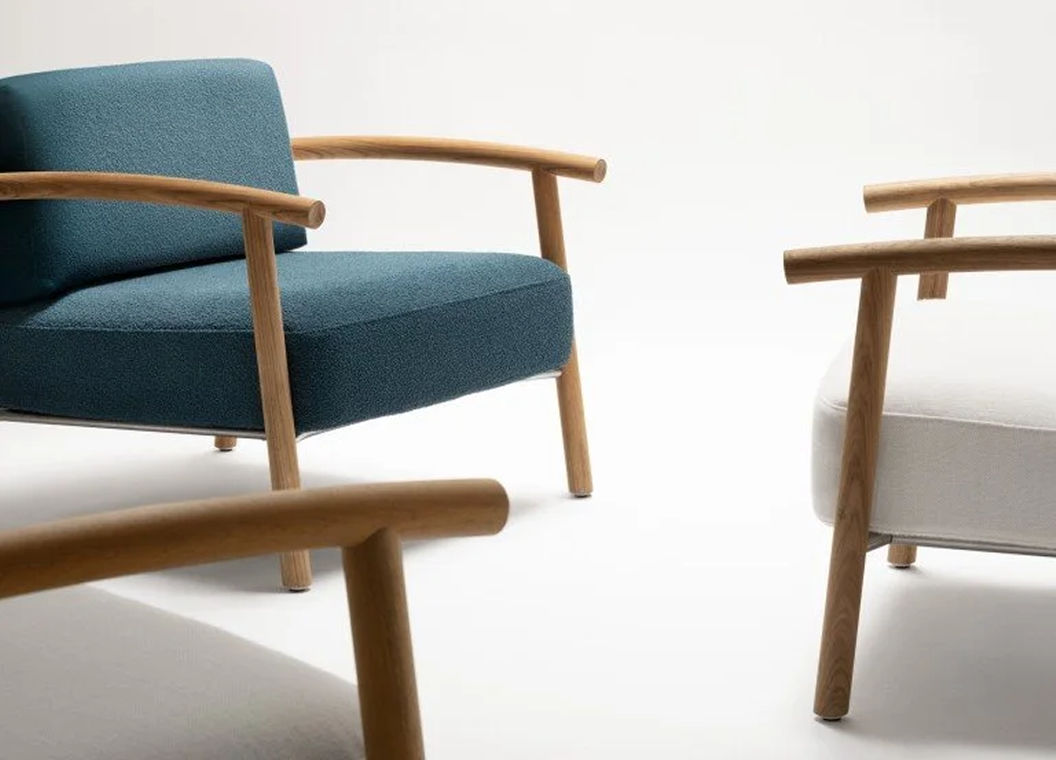 KASUMI lounge chair with sculptural upholstered design