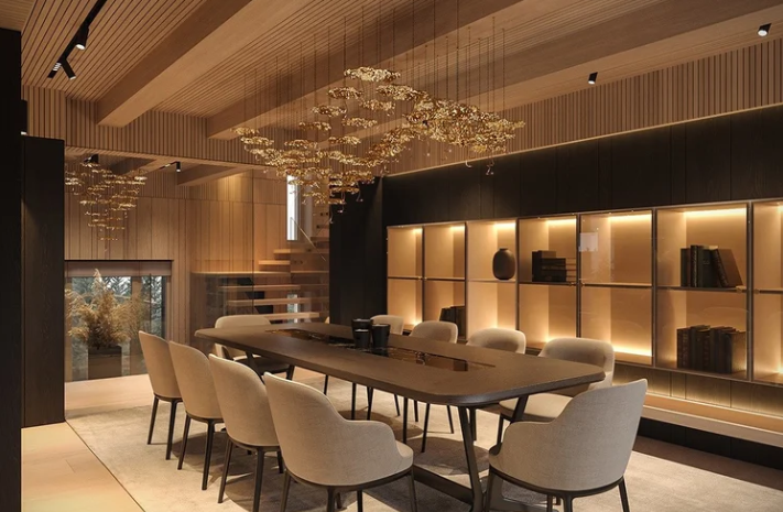 Gold Moon chandelier by Enzo Catellani with black and gold-wrapped LED lights suspended in a double-height reception room.