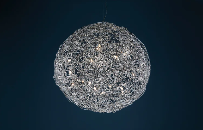 Fil de Fer chandelier by Enzo Catellani in hand-formed aluminum with integrated LED lights suspended in a refined interior space.