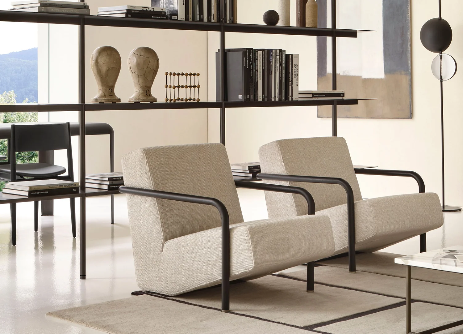 Lullaby Chair with curved armrests and upholstered lounge seating