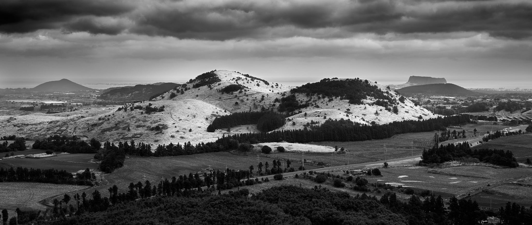 Yongnuni Oreum panorama close up from Sonji Oreum black and white