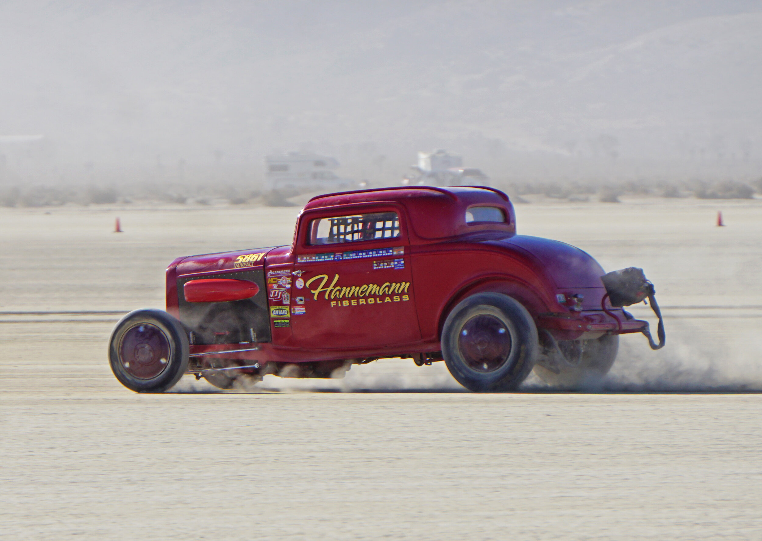 Tony Bartel driving the Harold Hanneman Fiberglass '32 3-window with vintage 4-cyliner runs about 125 mph.