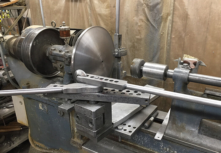 The steel former set up in the lathe. Each size and shape needs a different former.